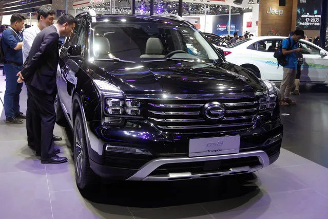 People look at GS8 by Trumpchi from GAC Group at China (Guangzhou) International Automobile Exhibition in Guangzhou, China November 18, 2016. (Photo by Bobby Yip/Reuters)