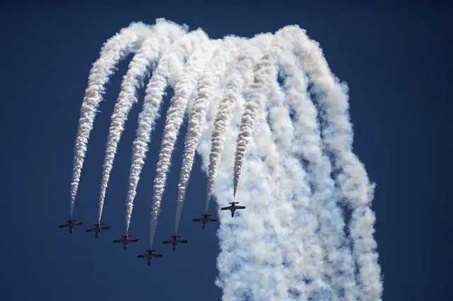 The aerobatic demonstration team of the Spanish Air Force “Patrulla Aguila” perform during the 2018 International Torre del Mar Airshow on July 29, 2018. (Photo by Jorge Guerrero/AFP Photo)
