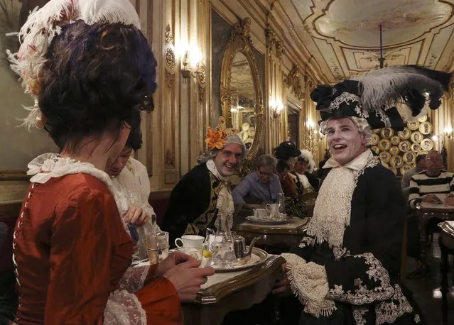 Revellers inside the Caffe Florian coffee shop in Saint Mark's Square during the Venice Carnival, February 7, 2015. (Photo by Stefano Rellandini/Reuters)