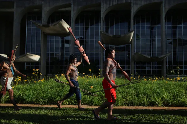 Indigenous people from the Munduruku tribe attend a demonstration in front of the Justice Palace, requesting demarcation of indigenous lands in the Amazon rainforest, in Brasilia, Brazil November 29, 2016. (Photo by Adriano Machado/Reuters)