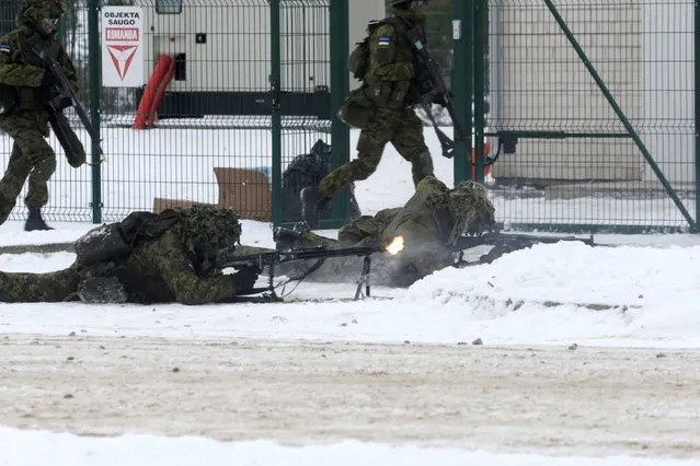 Estonian troops along with the other troops from 11 NATO nations take part in the exercise in urban warfare during Iron Sword exercise in the mock town near Pabrade, Lithuania, December 2, 2016. (Photo by Ints Kalnins/Reuters)