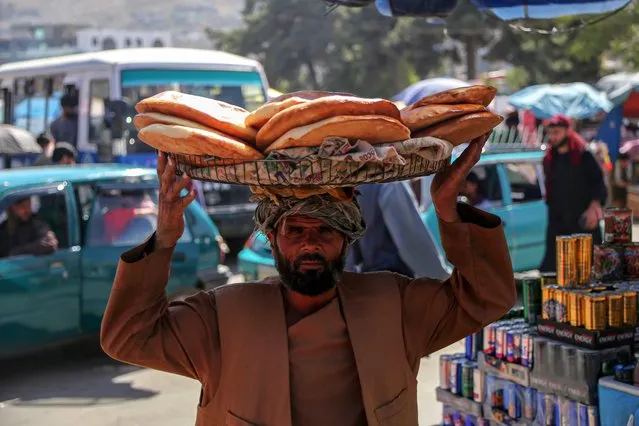 Afghan vendors sell bread on a roadside in Kabul, Afghanistan, 12 September 2023. The World Food Programme (WFP) has announced that it will have to cut off another two million hungry people from food assistance in Afghanistan due to a lack of funding. This means that a total of ten million people will be without WFP support this year, leaving only a fifth of the 15 million people in need with access to food assistance. The cuts are expected to worsen the already worrying levels of hunger and malnutrition in the country. The WFP is calling for USD one billion in funding over the next six months to reach 21 million people with life-saving food and nutrition assistance. (Photo by Samiullah Popal/EPA/EFE)