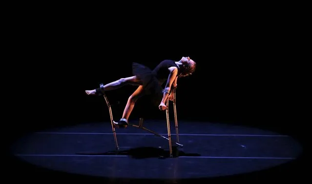 Scottish dancer Claire Cunningham, who was born with osteoporosis, performs “Mobile-Evolution” with crutches at Sergio Cardoso Theatre in Sao Paulo, Brazil, on Oktober 26, 2013. According to local media, Cunningham says using crutches gave her the physical abilities to create a career in dance. (Photo by Nacho Doce/Reuters)