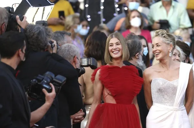 Rosamund Pike, left, and Sharon Stone pose for photographers upon arrival at the awards ceremony and premiere of the closing film “OSS 117: From Africa with Love” at the 74th international film festival, Cannes, southern France, Saturday, July 17, 2021. (Photo by Vianney Le Caer/Invision/AP Photo)