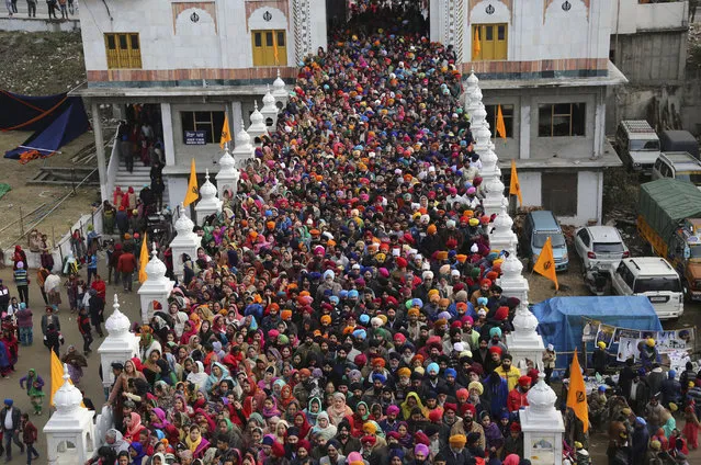 In this  Saturday, January 5, 2019, file photo, Indian Sikh devotees gather to pay obeisance at a Sikh temple as they mark the birth anniversary of Guru Gobind Singh, in Jammu, India. Guru Gobind Singh was the tenth Sikh guru. (Photo by Channi Anand/AP Photo)