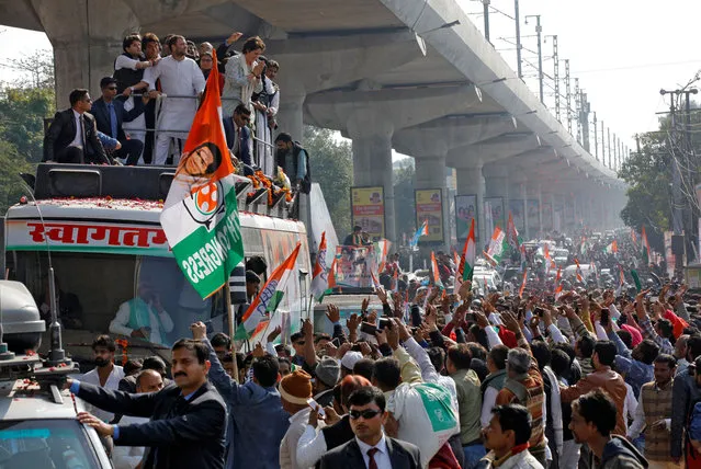 Priyanka Gandhi Vadra, a leader of India's main opposition Congress party and sister of the party president Rahul Gandhi, greets her supporters from atop a vehicle during a roadshow in Lucknow, February 11, 2019. (Photo by Pawan Kumar/Reuters)