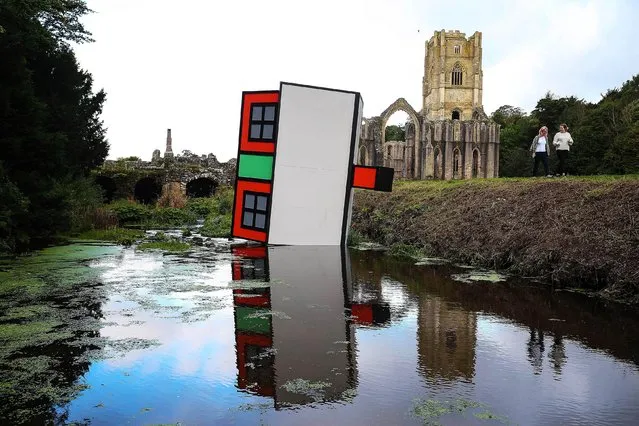 An art installation entitled Forever Home by Richard Woods, commissioned by the Climate Coalition to mark Great Big Green Week, is unveiled at Fountains Abbey, a National Trust property in North Yorkshire on September 23, 2021. The artwork aims to highlight the risk that floods linked to climate change pose to properties in the UK. (Photo by Nigel Roddis/Getty Images)