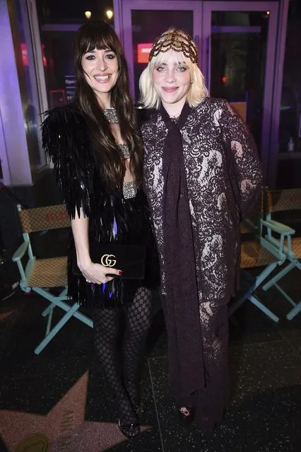 American actress Dakota Johnson, left, and Billie Eilish attend the Gucci “Love Parade” fashion show Tuesday, November 2, 2021, in Los Angeles. (Photo by Jordan Strauss/Invision/AP Photo)