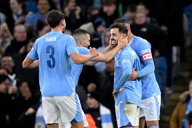 Bernardo Silva of Manchester City celebrates scoring his team's second goal with teammates during the Emirates FA Cup Quarter Final match between Manchester City and Newcastle United at Etihad Stadium on March 16, 2024 in Manchester, England. (Photo by Stu Forster/Getty Images)