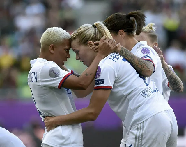 Ada Hegerberg of Lyon, front right, celebrates her goal with teammate Shanice van de Sanden, left,  during the women's soccer UEFA Champions League final match between Olympique Lyon and FC Barcelona at the Groupama Arena in Budapest, Hungary, Saturday, May 18, 2019. (Photo by Balazs Czagany/MTI via AP Photo)