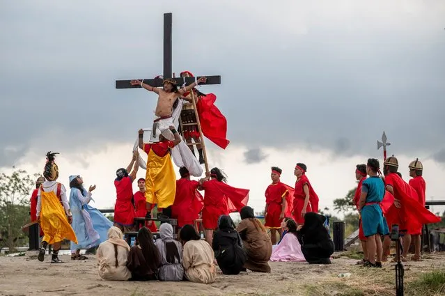 Filipino Catholic Ruben Enaje is nailed to the cross during his reenaction of the crucifixion of Jesus Christ on Good Friday, in San Fernando, Pampanga, Philippines, on March 29, 2024. (Photo by Lisa Marie David/Reuters)