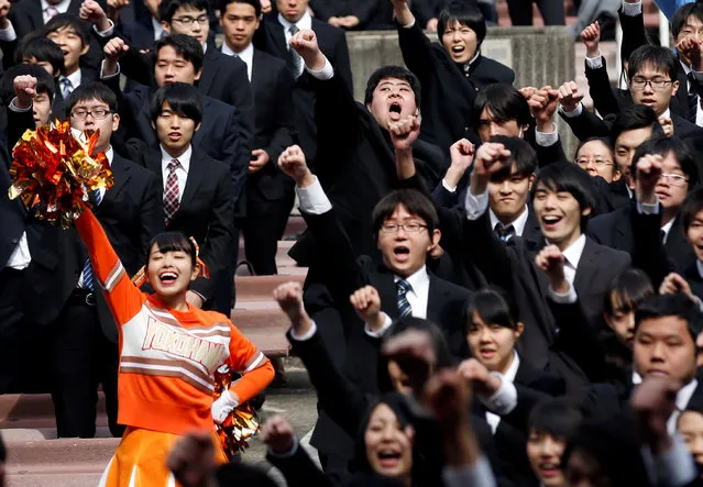 College students shout slogans during a pep rally organized to boost their morale ahead of their job hunting in Tokyo, Japan March 1, 2017. (Photo by Kim Kyung-Hoon/Reuters)