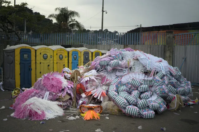 In this Tuesday, February 28, 2017 photo, costume pieces lay in a pile, to be returned to a samba school after the Carnival parade at the Sambadrome in Rio de Janeiro, Brazil. Rio's parade is world famous for the samba dancing, costumes and magnificent floats. (Photo by Leo Correa/AP Photo)