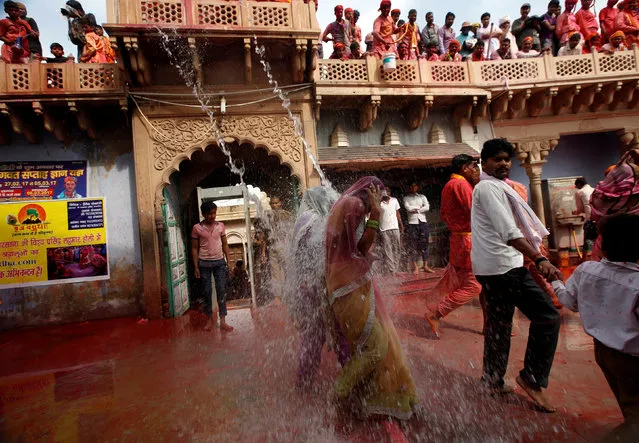 Hindu devotees take part in Holi in Nandgaon village, in the state of Uttar Pradesh, India, March 7, 2017. (Photo by Adnan Abidi/Reuters)