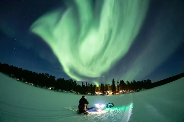 The Aurora Borealis (Northern Lights) are seen over the sky in Torassieppi in Lapland, Finland on March 2, 2021. (Photo by Alexander Kuznetsov/Reuters)