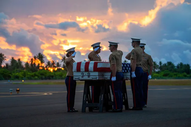 U.S. Marines from Marine Corps Forces, Pacific, salute a transfer case during a repatriation ceremony for the possible remains of unidentified service members lost in the Battle of Tarawa during WWII, Republic of Kiribati, July 18, 2019. The remains were recently recovered from sites in the Tarawa Atoll by History Flight, Inc., a DPAA partner organization, and will be accessioned into DPAA's laboratory facility in Hawaii to begin the identification process in support of DPAA's mission to provide the fullest possible accounting for our missing personnel to their families and the nation. (Photo by U S Army/ZUMA Wire/Shutterstock)