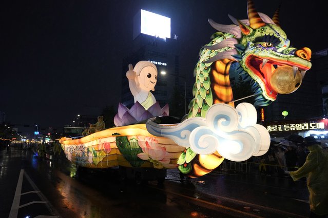 A giant lantern float moves past in a parade during the Lotus Lantern Festival, ahead of the birthday of Buddha at Dongguk University in Seoul, South Korea, Saturday, May 11, 2024. (Photo by Ahn Young-joon/AP Photo)