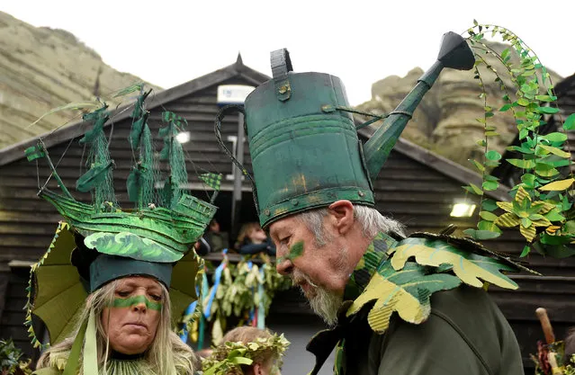 Participants take part in the annual Jack In The Green parade involving hundreds of costumed revellers joining a four hour procession culminating in the traditional “slaying” of a Jack character to “unleash the spirit of summer” on the May Day week end, in Hastings, southern Britain, May 2, 2016. (Photo by Toby Melville/Reuters)