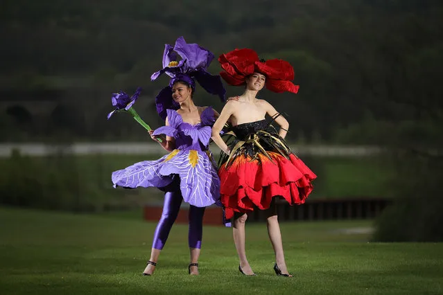 Models Lauren Green (L) and Abi Moore pose for photographers as they wear an Iris and Poppy flower gowns designed by New Zealand artist, Jenny Gillies on April 19, 2017 in Harrogate, England. The flower gowns are just some of the many dresses being displayed at this year's Harrogate Spring Show between 20-23 April 2017. It is the first time that the creations by by the award winning New Zealand artist, Jenny Gillies have been displayed in the Northern Hemisphere. (Photo by Christopher Furlong/Getty Images)