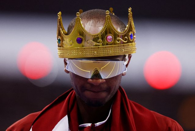 Bronze medallist Qatar's Mutaz Essa Barshim wears a crown as he celebrates competing in the men's high jump final of the athletics event at the Paris 2024 Olympic Games at Stade de France in Saint-Denis, north of Paris, on August 10, 2024. (Photo by Hannah Mckay/Reuters)