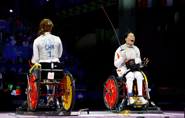 Zou Xufeng of China celebrates after winning gold against Gu Haiyan of China in the wheelchair fencing at the Paris Paralympics on September 4, 2024. (Photo by Carlos Garcia Rawlins/Reuters)