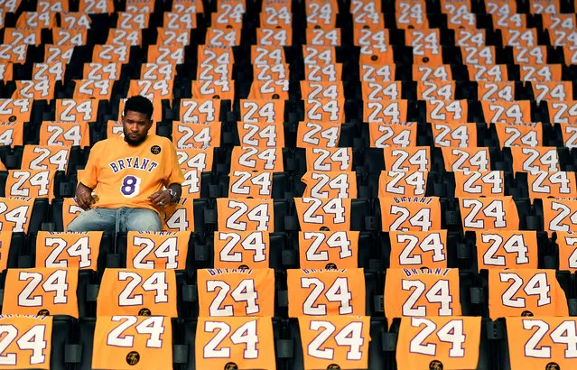 Usher sits alone in the stands at the Staples Center before his performance tonight to honor Lakers great Kobe Bryant on January 31, 2020 in Los Angeles, California. (Wally Skalij/Los Angeles Times via Getty Images)