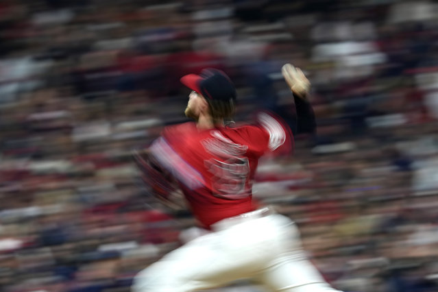 In this image taken with a slow shutter speed, Cleveland Guardians starting pitcher Tanner Bibee throws against the New York Yankees during the fourth inning in Game 5 of the baseball AL Championship Series Saturday, October 19, 2024, in Cleveland. (Photo by Godofredo A. Vásquez/AP Photo)