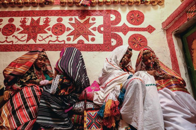 Girls dressed in traditional attire take part in the Ghadames Festival celebrating the cultural and artistic heritage of the Libyan city, on October 23, 2024. (Photo by Mahmud Turkia/AFP Photo)