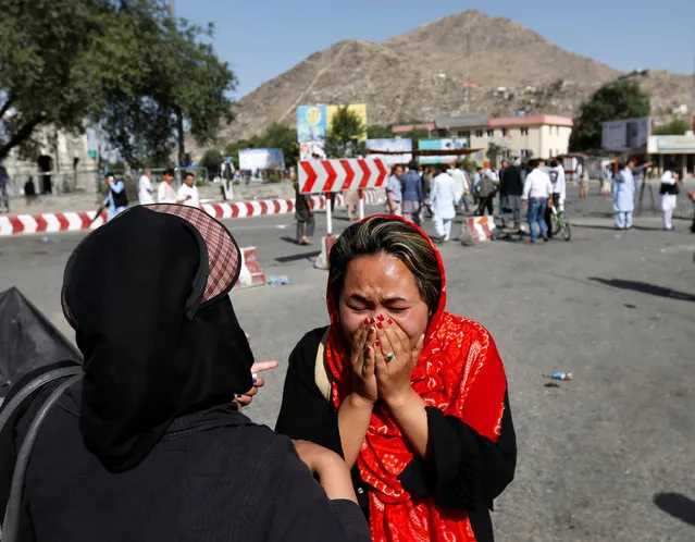 An Afghan woman weeps at the site of a suicide attack in Kabul, Afghanistan July 23, 2016. (Photo by Mohammad Ismail/Reuters)