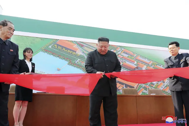 In this Friday, May 1, 2020, photo provided by the North Korean government, North Korean leader Kim Jong Un, center, cuts a tape, watched by his sister Kim Yo Jong, during his visit to a fertilizer factory in Sunchon, South Pyongan province, near Pyongyang, North Korea. Kim made his first public appearance in 20 days as he celebrated the completion of the fertilizer factory, state media said Saturday, May 2, 2020, ending an absence that had triggered global rumors that he may be seriously ill.  Independent journalists were not given access to cover the event depicted in this image distributed by the North Korean government. The content of this image is as provided and cannot be independently verified. Korean language watermark on image as provided by source reads: “KCNA” which is the abbreviation for Korean Central News Agency. (Photo by Korean Central News Agency/Korea News Service via AP Photo)