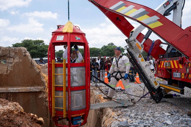 Workers from Mines Rescue Services operate the mechanical cage that was used for rescue operations at the mine shaft, where rescue operations are now completed, as authorities say that no miners remain below ground after attempts were made to rescue illegal miners who have been underground for months, in Stilfontein, South Africa, on January 16, 2025. (Photo by Ihsaan Haffejee/Reuters)