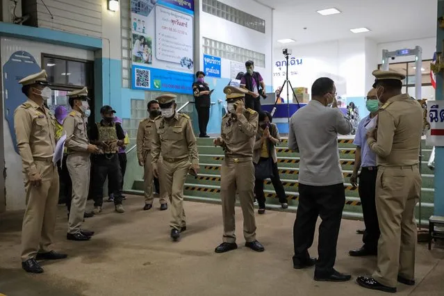 Police officers stand outside a hospital where the injured are being treated on October 06, 2022 after a shooting in Uthai Sawan subdistrict, Nong Bua Lamphu, Thailand. Thai police said that former police officer Panya Kamrab, 34, had killed at least 38 people, including 24 children – some as young as 2 – in a mass shooting and stabbing at Child Development Center Uthaisawan – a child care center in northeast Thailand. The assailant subsequently shot himself and his family, police said. The shooting comes two years after a disgruntled soldier killed 29 people in a shooting at a mall in 2020, and is the country's deadliest mass killing perpetrated by a lone gunman. (Photo by Lauren DeCicca/Getty Images)