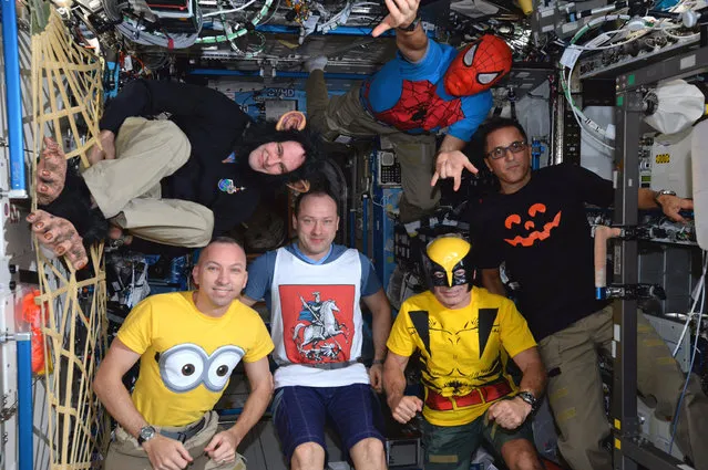The crew of the International Space Station dresses up for Halloween on October 31, 2017. NASA astronaut Randy Bresnik, lower left, tweeted the photo, writing “Exp 53 crew would like to join with children all over the world for this one special day they can be whoever they want to be”. Clockwise from lower left: Bresnik, cosmonaut Sergey Ryazansky, Italian astronaut Paolo Nespoli as Spider-Man, NASA astronaut Joseph Acaba, NASA astronaut Mark Vande Hei, and cosmonaut Alexander Misurkin. (Photo by NASA)