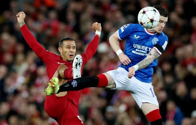 Thiago Alcántara of Liverpool (L) defends the ball from Ryan Kent of Rangers (R) during the UEFA Champions League group A match between Liverpool FC and Rangers FC at Anfield on October 4, 2022 in Liverpool, United Kingdom. (Photo by Phil Noble/Reuters)