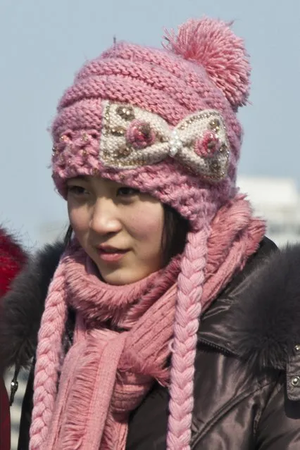 A resident of the capital is wrapped up in a hat and scarf to ward against the cold in February 2013, in Pyongyang, North Korea. (Photo by Andrew Macleod/Barcroft Media)