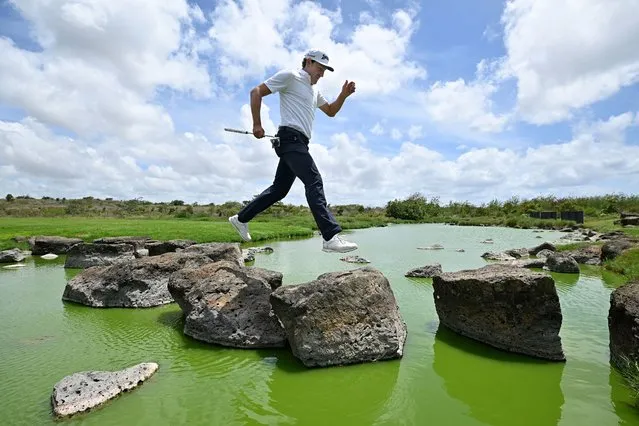 Alfredo Garcia-Heredia of Spain crosses the water on the 7th hole on Day Four of the AfrAsia Bank Mauritius Open at Mont Choisy Le Golf on December 18, 2022 in Port Louis, Mauritius. (Photo by Stuart Franklin/Getty Images)