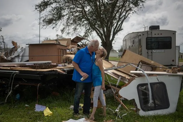 Lonnie Gatte and Teri Goleman kiss after returning to their residence, a 40-foot camping trailer, to find it completely destroyed in the aftermath of Hurricane Laura in Sulphur, Louisiana, August 27, 2020. Hurricane Laura ripped through Louisiana on Thursday, destroying buildings in towns across the southwestern corner of the state and killing four people, as one of the most powerful storms to hit the state. (Photo by Adrees Latif/Reuters)