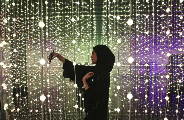 An Emirati woman takes a selfie at the Museum of the Future of the World Government Summit in Dubai, United Arab Emirates, Monday, February 12, 2018. (Photo by Kamran Jebreili/AP Photo)