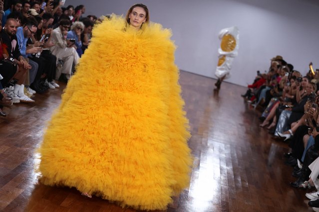 A model presents a creation by designer Walerio Araujo during Sao Paulo Fashion Week, in Sao Paulo, Brazil, on April 12, 2024. (Photo by Carla Carniel/Reuters)