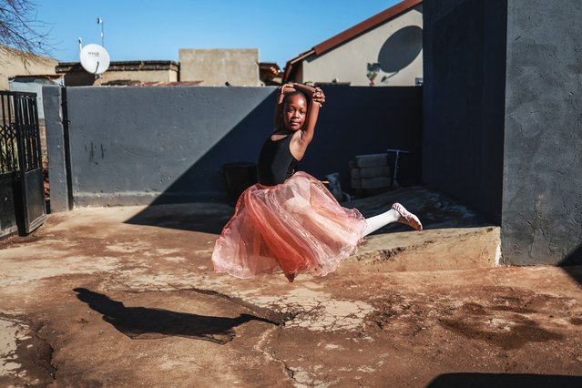 Owethu Nhleko, 11, poses for a photograph outside the Mballet Dance Academy in Tembisa, South Africa on July 26, 2025, as they prepare for the upcoming Joburg auditions of The Nutcracker. Mballet Dance Academy is a small, deeply rooted dance academy in Winnie Mandela's section of Tembisa township. Created not just to teach ballet but to open doors in a community where resources are few and dreams often feel out of reach. (Photo by Phill Magakoe/AFP Photo)