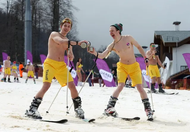 People in swimsuits participate in the BoogelWoogel alpine carnival at the Rosa Khutor Alpine Resort in Krasnaya Polyana, Sochi, Russia on March 31, 2018. (Photo by Artur Lebedev/TASS)