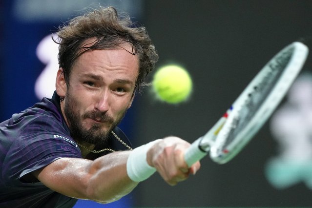 Daniil Medvedev of Russia returns a backhand shot from Alex De Minaur of Australia during their men's singles quarterfinal match of the Shanghai Masters tennis tournament at Qizhong Forest Sports City Tennis Center, in Shanghai, China, Friday, October 10, 2025. (Photo by Andy Wong/AP Photo)