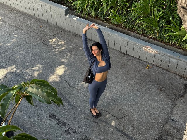 American model and socialite Kendall Jenner stretches in an Alo set on October 23, 2025. (Photo by kendalljenner/Instagram)