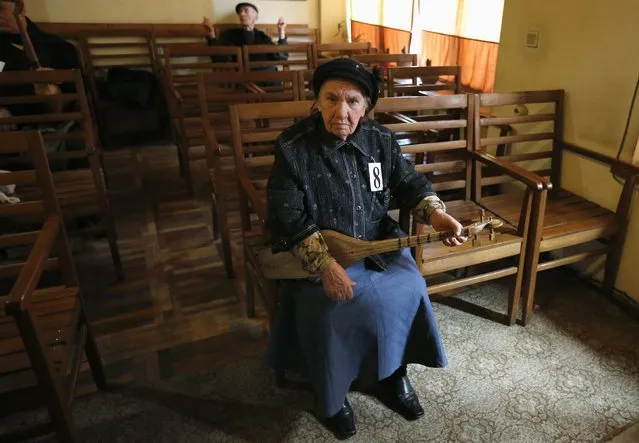 Tsiala Macharashvili, 82, waits for her performance during the “Super Grandmother and Super Grandfather” contest in Tbilisi, January 5, 2015. (Photo by David Mdzinarishvili/Reuters)
