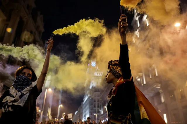 Women hold flares during a march to mark the International Day Against Homophobia, Transphobia, and Biphobia, in Madrid, Spain May 17, 2018. (Photo by Susana Vera/Reuters)