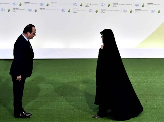 Iranian Vice-President Masoumeh Ebtekar (R) is welcomed by French President Francois Hollande upon her arrival for the opening of the UN conference on climate change, on November 30, 2015 at Le Bourget, on the outskirts of the French capital Paris. More than 150 world leaders are meeting under heightened security, for the 21st Session of the Conference of the Parties to the United Nations Framework Convention on Climate Change (COP21/CMP11), also known as “Paris 2015” from November 30 to December 11. (Photo by Loic Venance/AFP Photo)