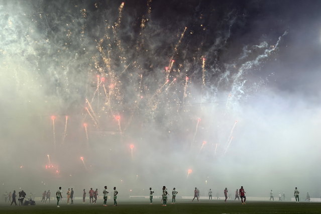 Players from Medellin and Nacional watch firework in the second leg of the Copa Colombia final between Medellin and Nacional at the Atanasio Girardot stadium in Medellin, Colombia, 17 December 2025. (Photo by EPA/EFE/Stringer)