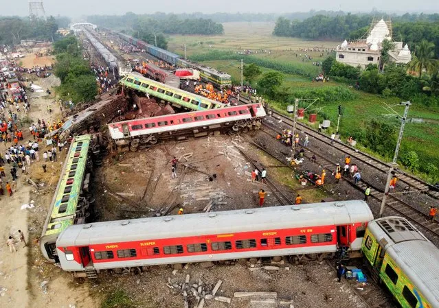 A drone view shows derailed coaches after two passenger trains collided in Balasore district in the eastern state of Odisha, India on June 3, 2023. (Photo by Reuters/Stringer)