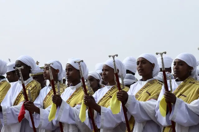 Ethiopian Orthodox worshippers take part in the annual Epiphany celebrations called “Timket” in Addis Ababa January 19, 2015. “Timket” commemorates Jesus Christ's baptism in the Jordan River by John the Baptist. (Photo by Tiksa Negeri/Reuters)