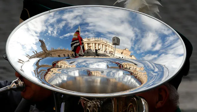 Saint Peter's basilica is reflected in a tuba as Pope Francis leads a Jubilee audience in Saint Peter's square at the Vatican November 12, 2016. (Photo by Remo Casilli/Reuters)